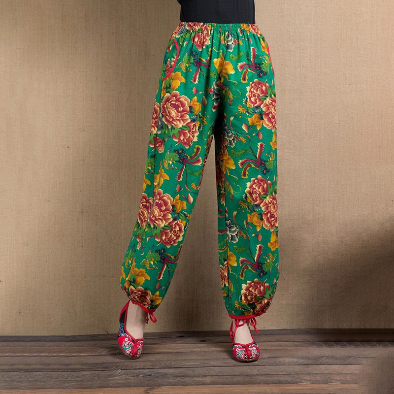 Pantalones harén con estampado de flores rojas y verdes de estilo étnico Mythstone y bolsillos 