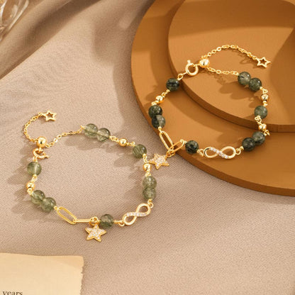 Pulsera de protección con estrellas del amor eterno y cuarzo rutilado verde en oro de 14 quilates de Mythstone con lazo Möbius 