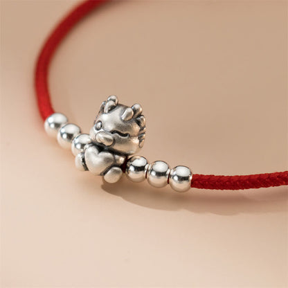 Pulsera roja con la suerte del año del dragón en plata de ley 999 hecha a mano por Mythstone