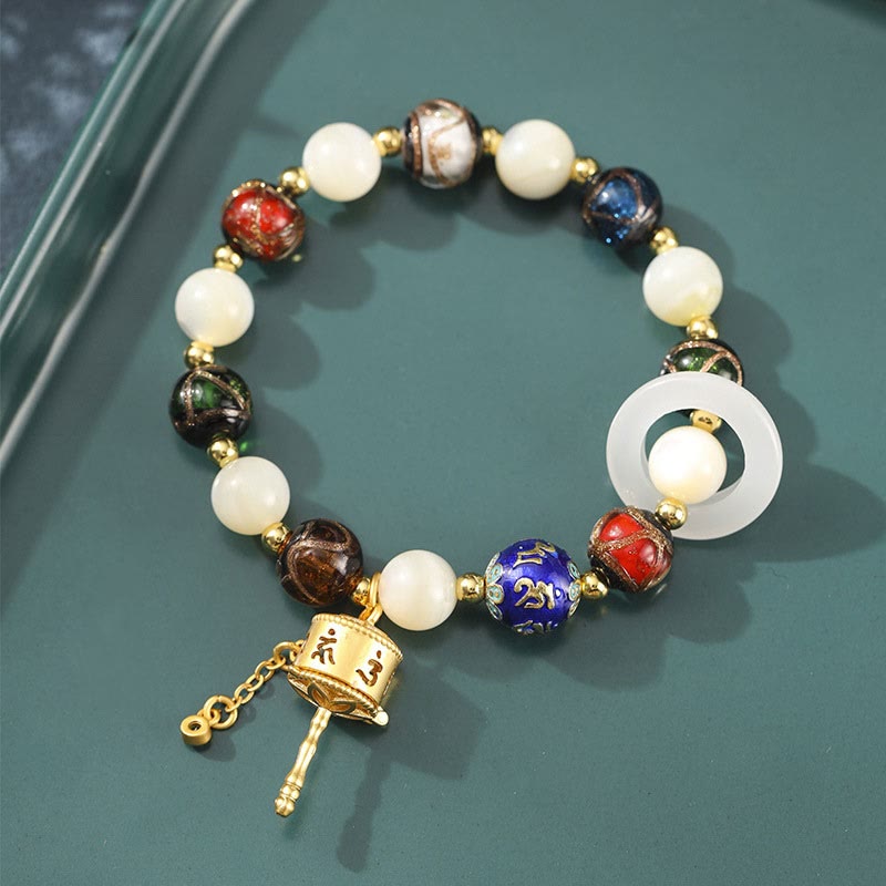 Pulsera con dijes de rueda de oración Om Mani Padme Hum, piedra del sol, piedra Tridacna, vidrio Liuli, incienso tibetano Mythstone