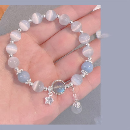 Pulsera de soporte con dije de estrella y mariposa con piedra lunar y ojo de gato de Mythstone