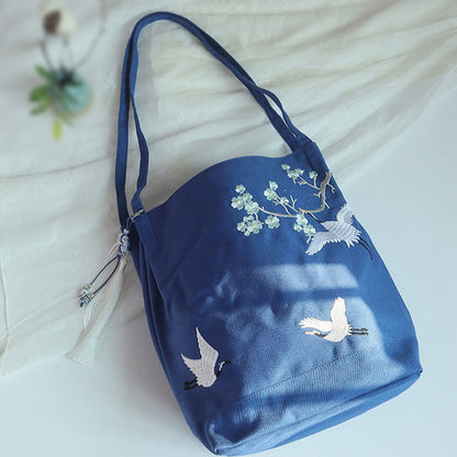 Bolso de mano de lona de gran capacidad con bordado de flores de ciruelo y grulla de Mythstone