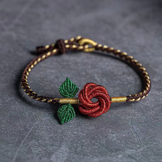 Pulsera hecha a mano con nudo de la paz y ocho hilos con flor de rosa Mythstone