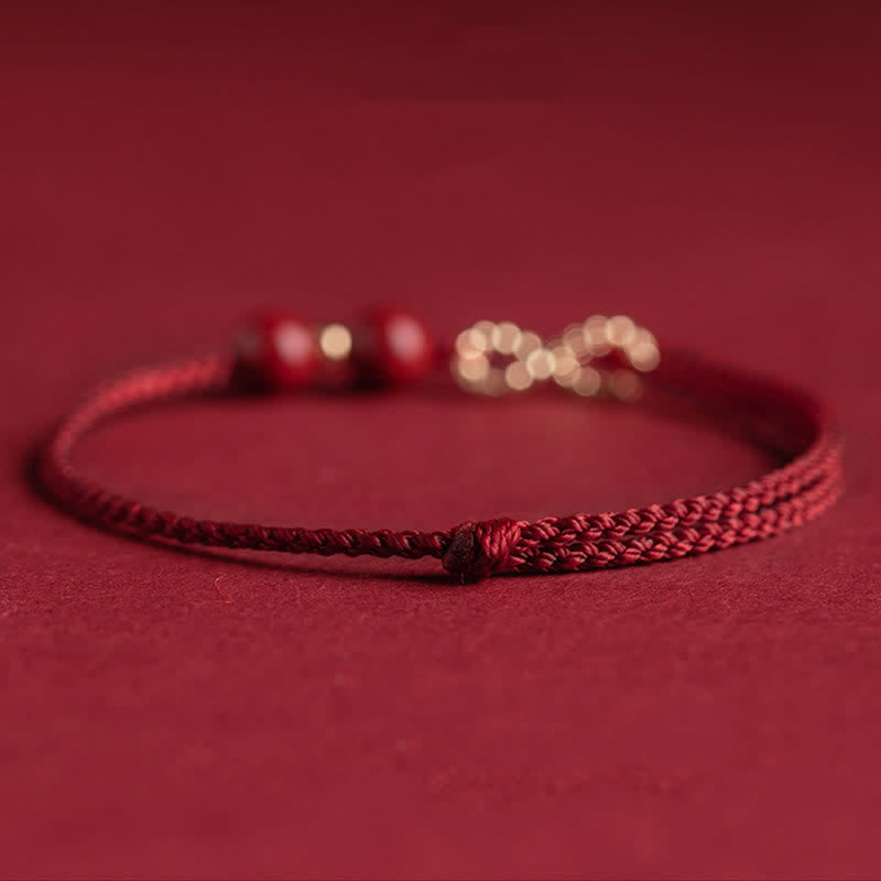 Pulsera tobillera con símbolo del infinito en oro de 14 quilates y hilo rojo con bendición de cinabrio de MythStone