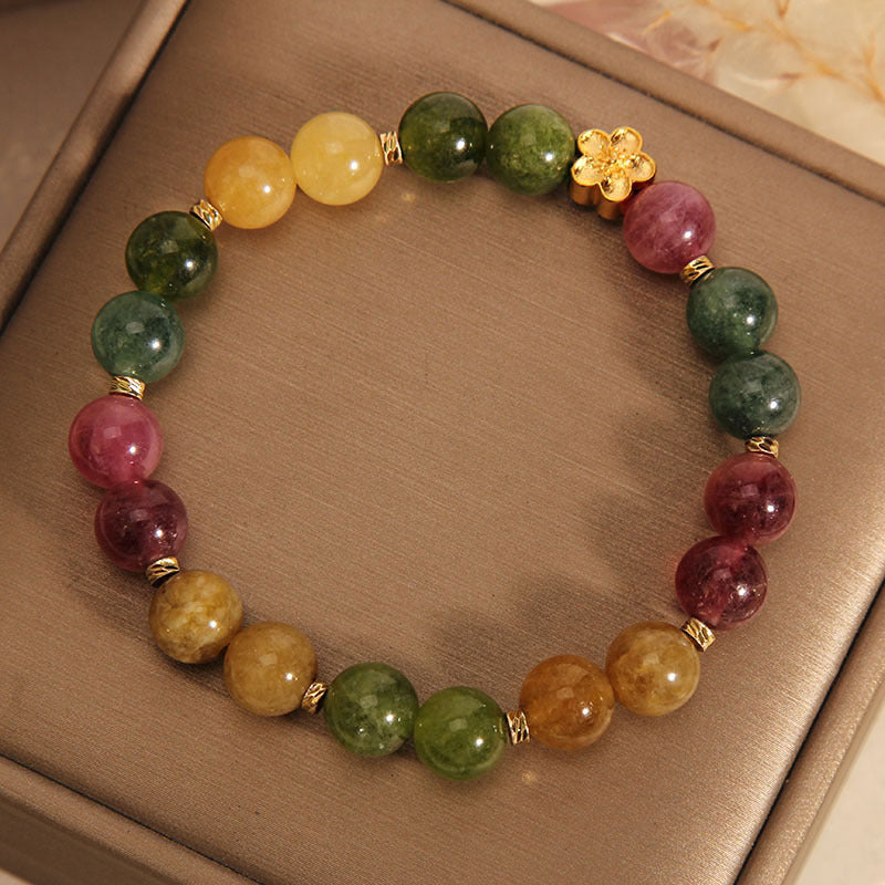 Pulsera positiva con flor dorada y turmalina natural de colores Mythstone