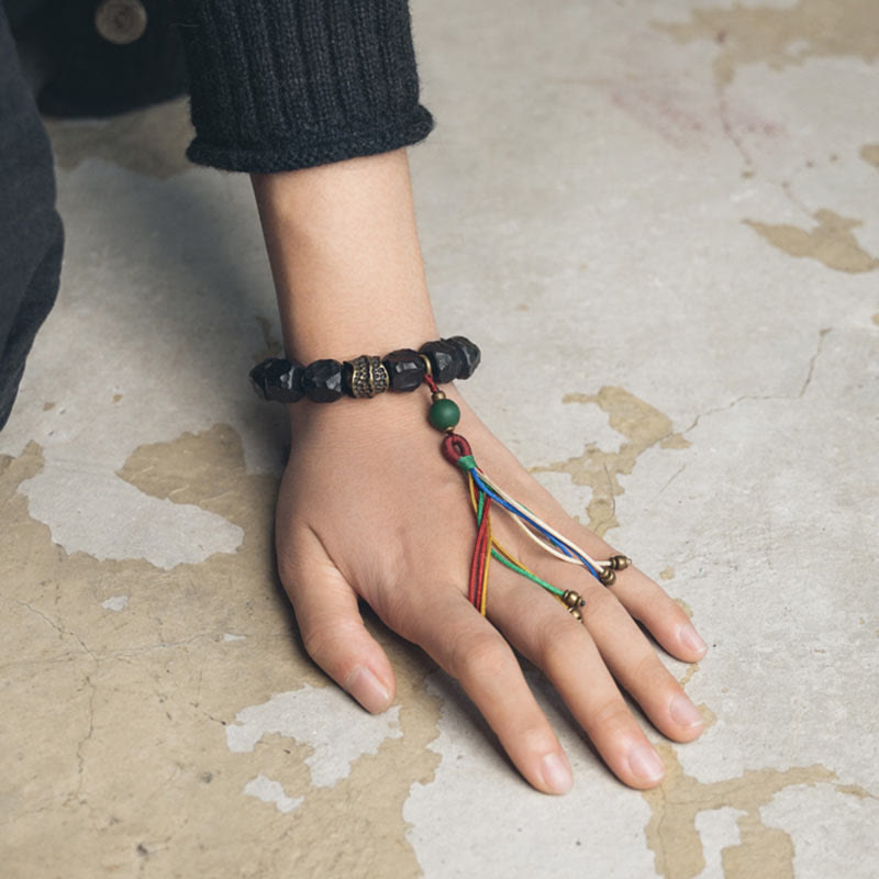 Mythstone Tibet Ebony Wood Copper Peace Tassel Wrist Mala Bracelet