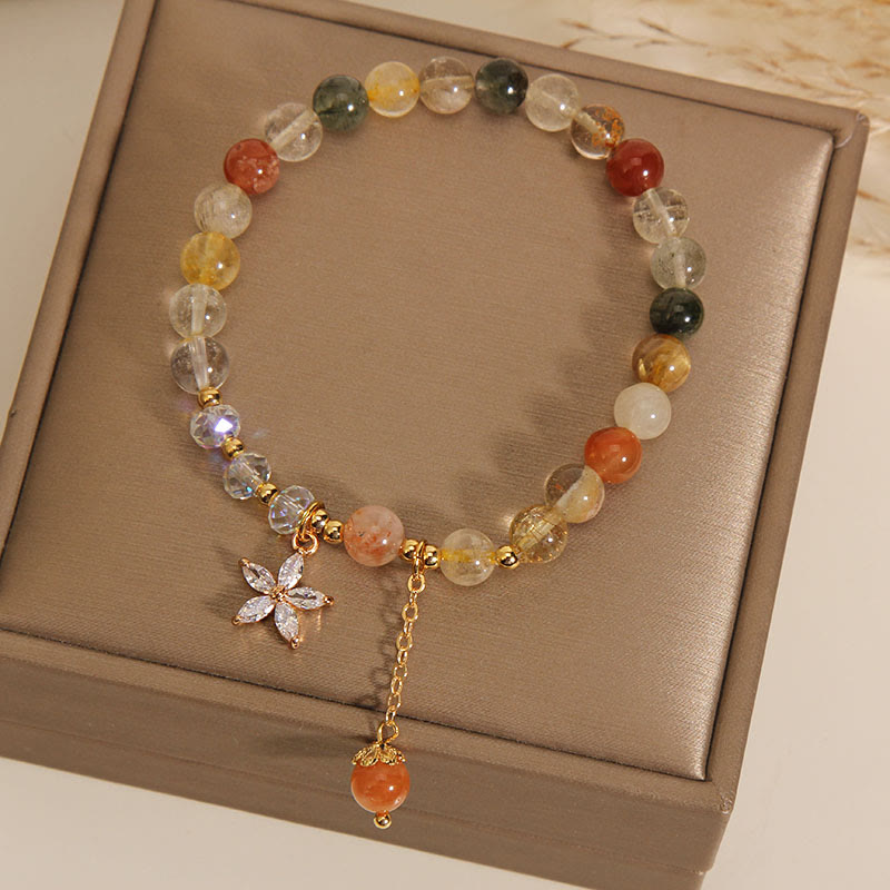 Pulsera de cuarzo rutilado multicolor con circonitas auspiciosas y flor de Mythstone