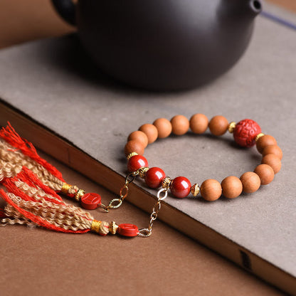 Pulsera de borlas de riqueza PiXiu con cinabrio de madera de melocotón natural tibetano Mythstone 