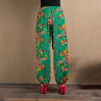 Pantalones harén con estampado de flores rojas y verdes de estilo étnico Mythstone y bolsillos 