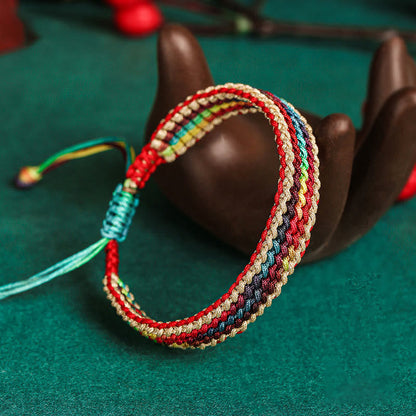 Pulsera trenzada de protección multicolor hecha a mano con piedra mítica del Tíbet