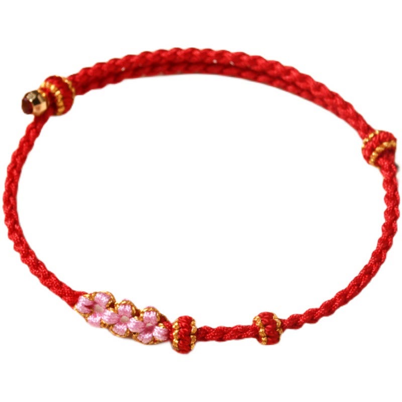 Pulsera trenzada de protección de flor de durazno hecha a mano de Mythstone