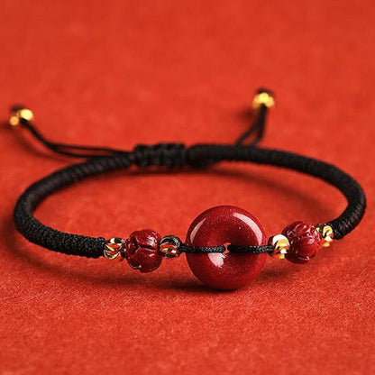 Pulsera trenzada con bendición y hebilla de paz de cinabrio de loto hecha a mano de Mythstone