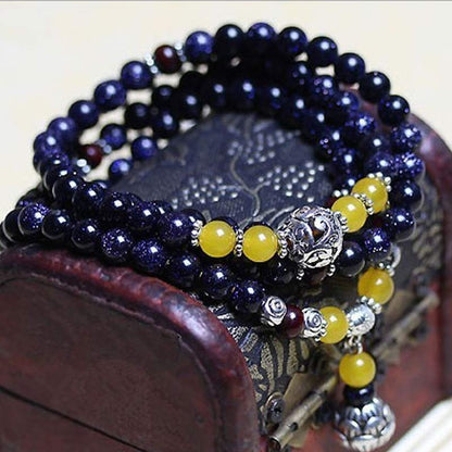 Pulsera con dije de riqueza de piedra arenisca azul MythStone Mala 