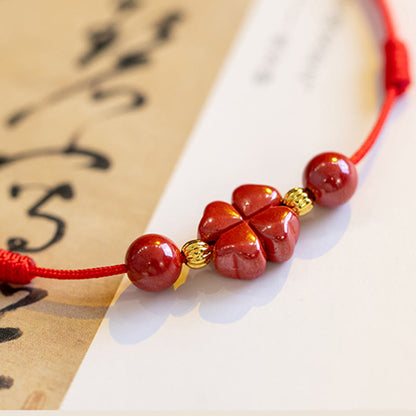 Pulsera de tobillo con trébol de cuatro hojas y cinabrio que bendice la calma