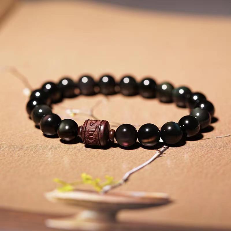 Pulsera curativa con personaje Om Mani Padme Hum Fu y obsidiana arcoíris con brillo dorado natural de Mythstone 