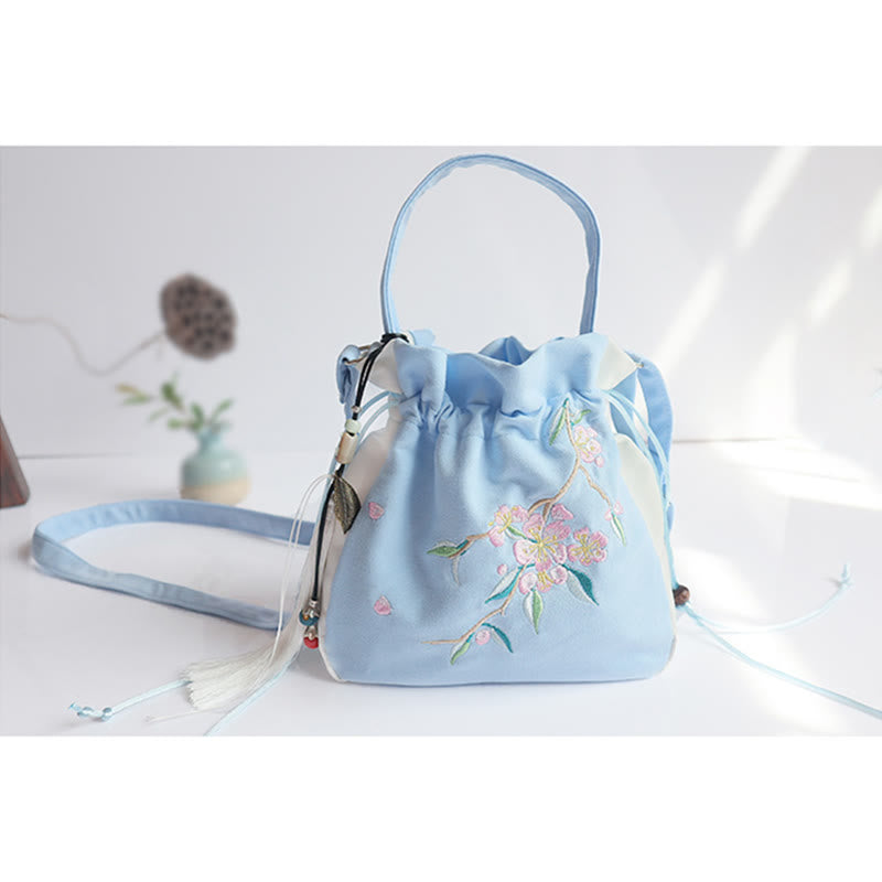 Bolso de mano de lona con flores bordadas a mano de Mythstone