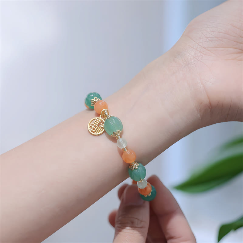 Pulsera de la riqueza con abalorios de calabaza de jade y seda dorada natural de Mythstone 