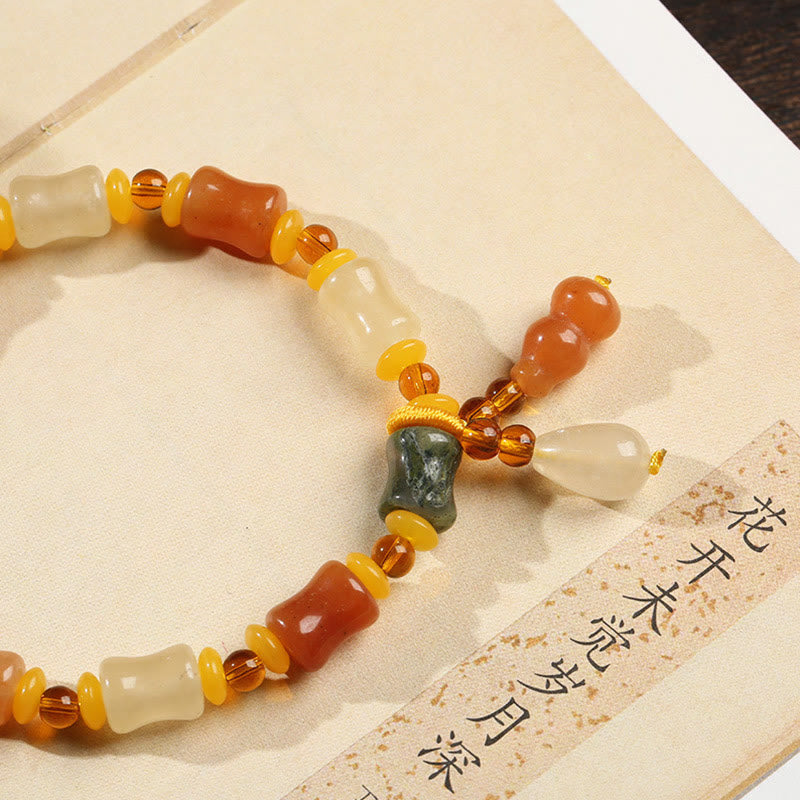 Pulsera con dije de riqueza de calabaza de jade de seda dorada natural Mythstone 