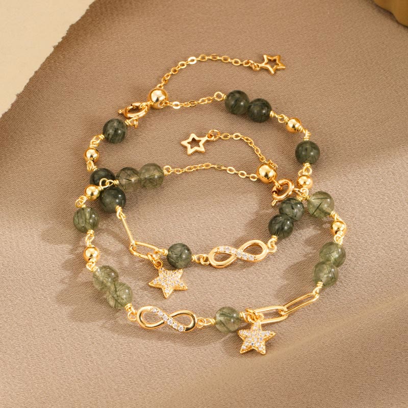 Pulsera de protección con estrellas del amor eterno y cuarzo rutilado verde en oro de 14 quilates de Mythstone con lazo Möbius 