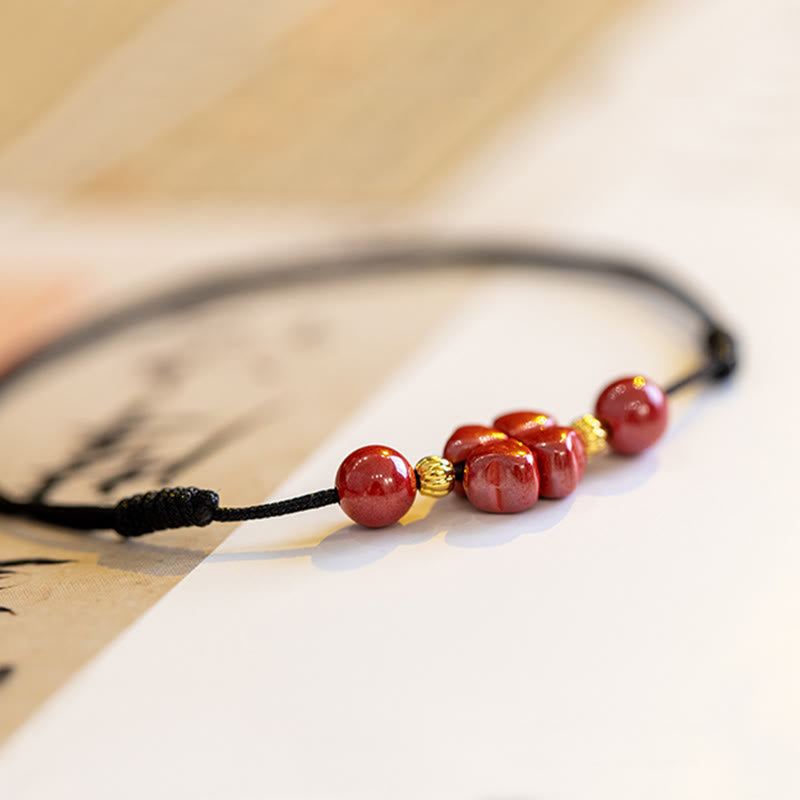 Pulsera de tobillo con trébol de cuatro hojas y cinabrio que bendice la calma