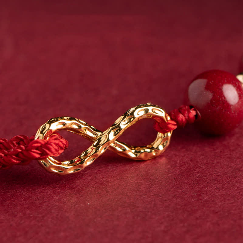 Pulsera tobillera con símbolo del infinito en oro de 14 quilates y hilo rojo con bendición de cinabrio de MythStone