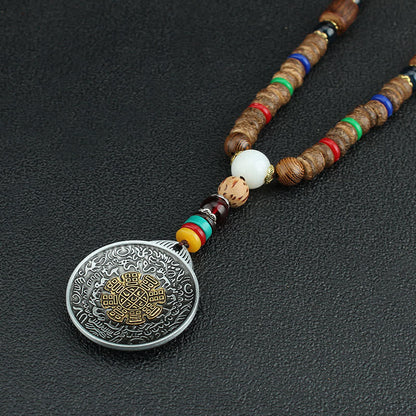 Collar con colgante de madera Vajra con rueda de oración tibetana Om Mani Padme Hum de Mythstone