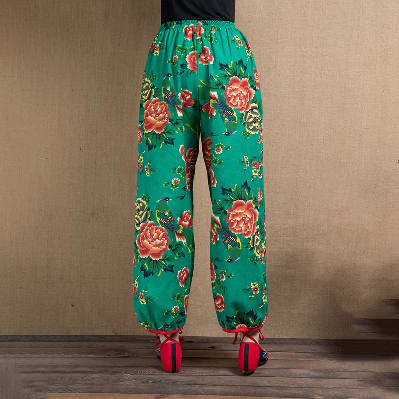 Pantalones harén con estampado de flores rojas y verdes de estilo étnico Mythstone y bolsillos 