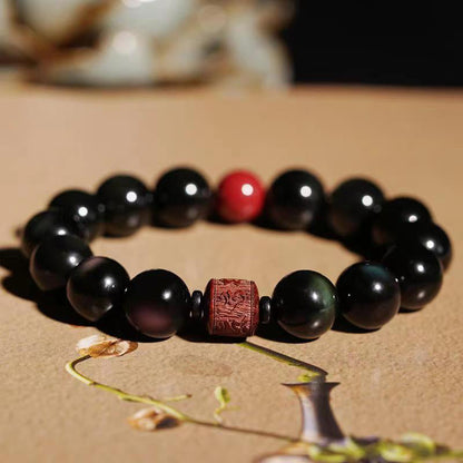 Pulsera curativa con personaje Om Mani Padme Hum Fu y obsidiana arcoíris con brillo dorado natural de Mythstone 