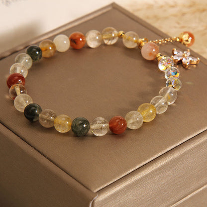 Pulsera de cuarzo rutilado multicolor con circonitas auspiciosas y flor de Mythstone