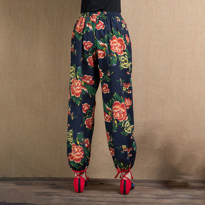 Pantalones harén con estampado de flores rojas y verdes de estilo étnico Mythstone y bolsillos 