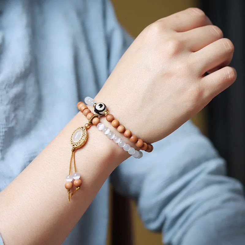 Mythstone Sandalwood Cat's Eye Three-eyed Dzi Bead Crystal Protectioin Bracelet - Image 11