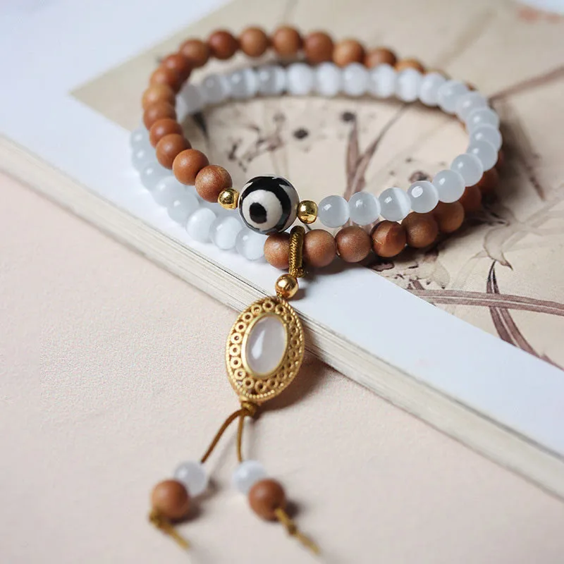Mythstone Sandalwood Cat's Eye Three-eyed Dzi Bead Crystal Protectioin Bracelet - Image 2